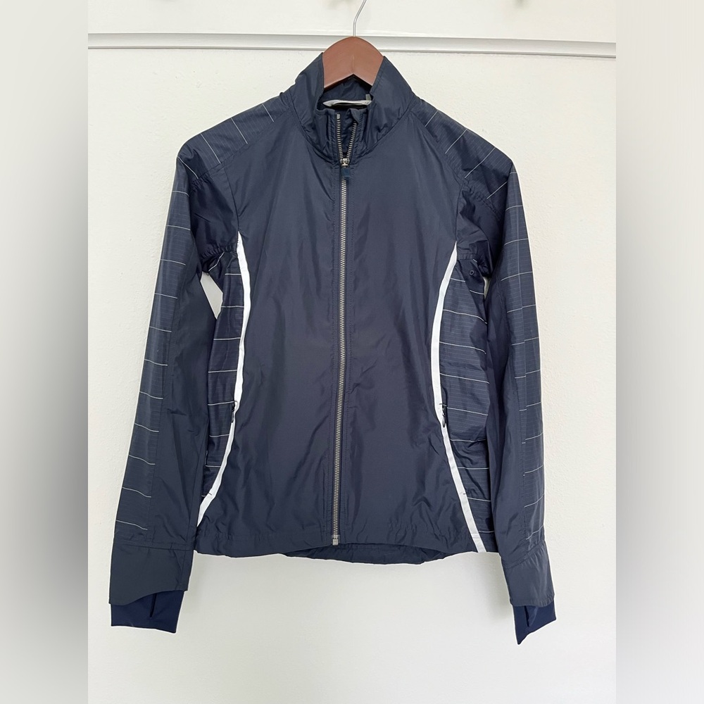 Athleta XXS Navy Windbreaker with reflective details.